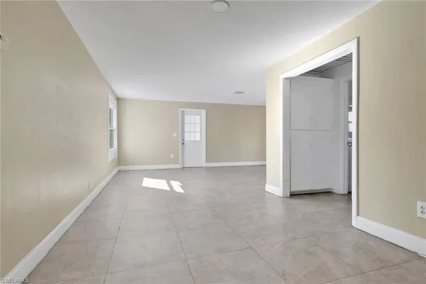a view of an empty room and window