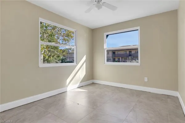 a view of an empty room with a window