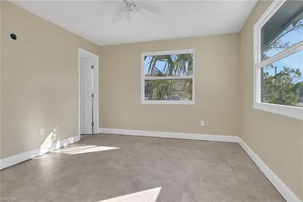 an empty room with windows