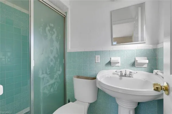 a bathroom with a sink and a toilet