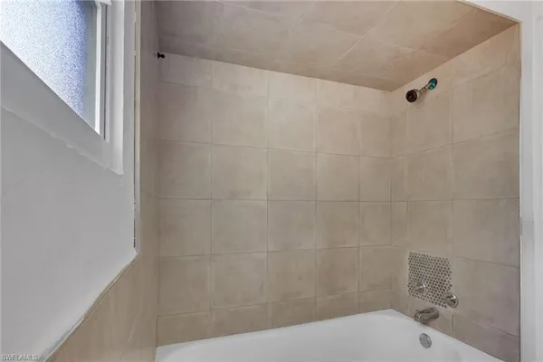 a bathroom with a shower and toilet