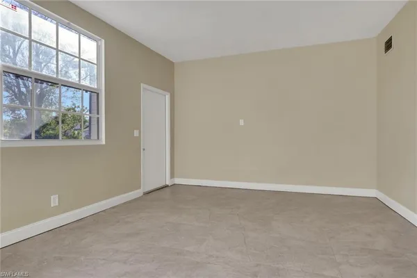 an empty room with windows