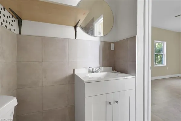a bathroom with a sink and a mirror