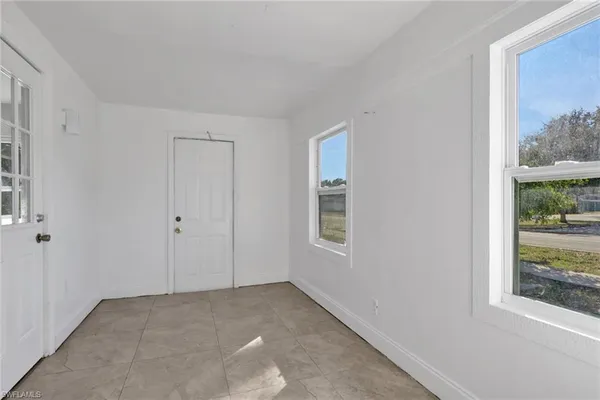a view of an empty room with a window