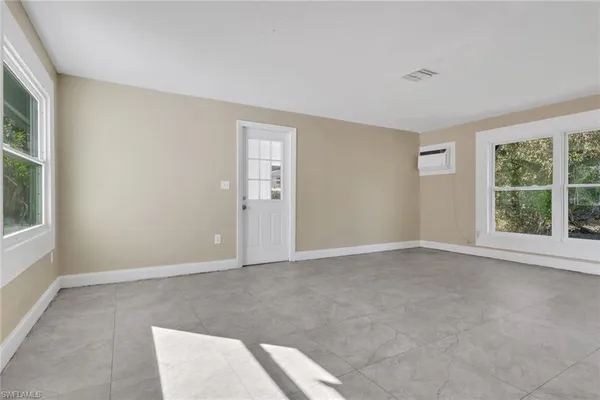 an empty room with windows