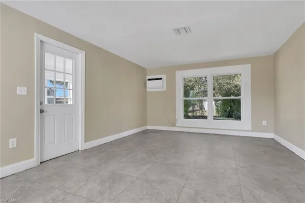 an empty room with windows