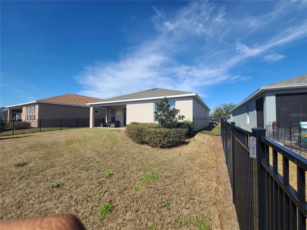 5380 Northwest 43rd Ln Road Ocala, FL 34482 - Photo 11 of 54 a house view with a backyard space