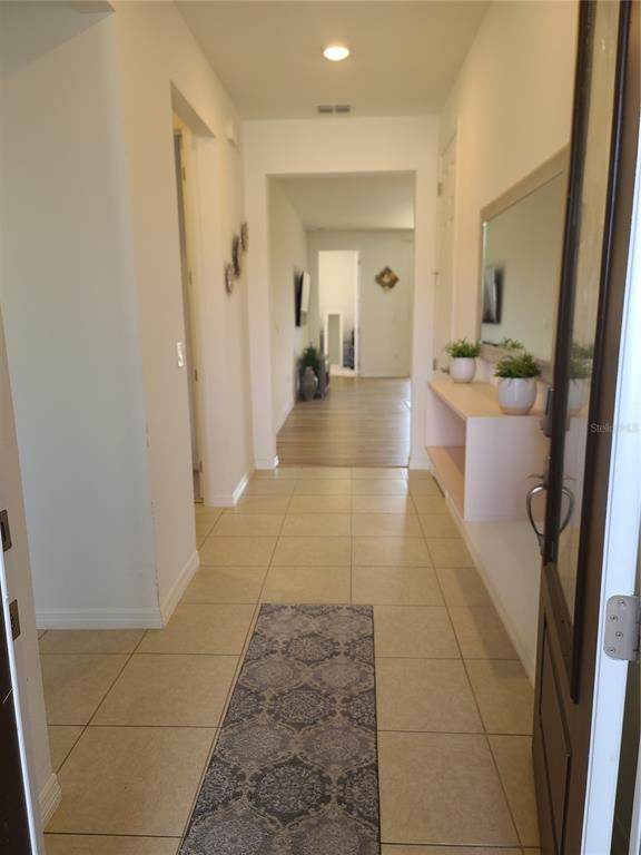 5380 Northwest 43rd Ln Road Ocala, FL 34482 - Photo 12 of 54 a bathroom with a sink a mirror and a shower