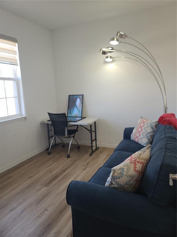 5380 Northwest 43rd Ln Road Ocala, FL 34482 - Photo 17 of 54 a living room with furniture and a chandelier