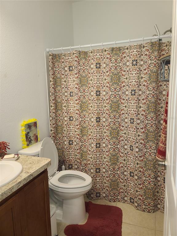 5380 Northwest 43rd Ln Road Ocala, FL 34482 - Photo 20 of 54 a bathroom with a toilet and a shower curtain