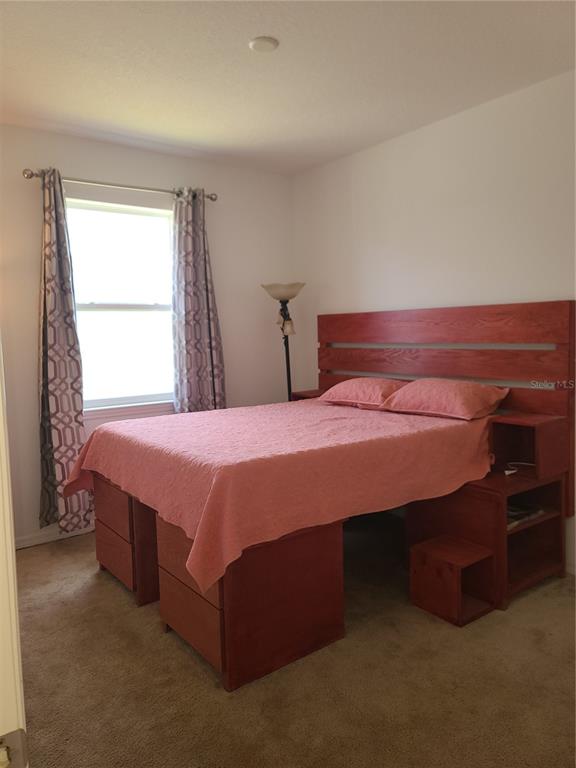 5380 Northwest 43rd Ln Road Ocala, FL 34482 - Photo 22 of 54 a bedroom with a bed and a window