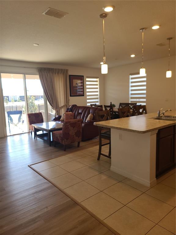 5380 Northwest 43rd Ln Road Ocala, FL 34482 - Photo 25 of 54 a living room with couches a computer and a large window