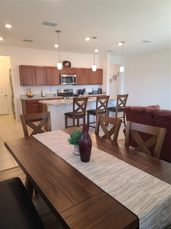 5380 Northwest 43rd Ln Road Ocala, FL 34482 - Photo 28 of 54 a kitchen with a table and chairs