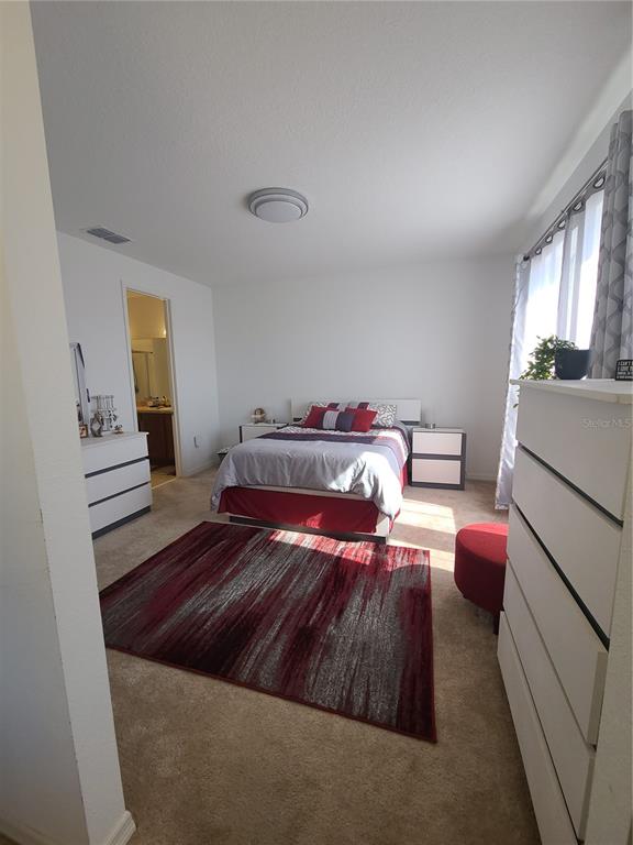 5380 Northwest 43rd Ln Road Ocala, FL 34482 - Photo 42 of 54 a bedroom with a bed and a dresser