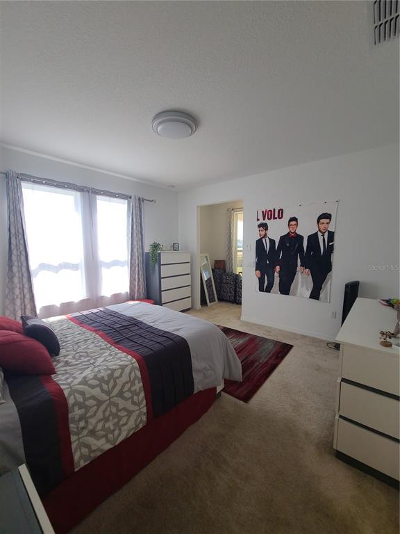 5380 Northwest 43rd Ln Road Ocala, FL 34482 - Photo 46 of 54 a bedroom with a bed and window