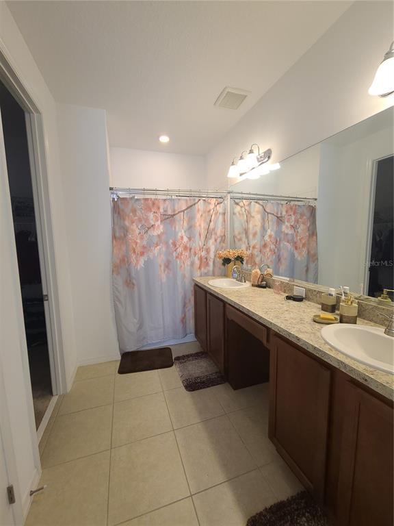5380 Northwest 43rd Ln Road Ocala, FL 34482 - Photo 47 of 54 a bathroom with a sink a toilet and mirror