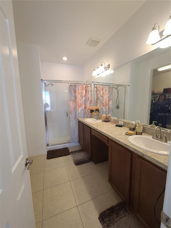 5380 Northwest 43rd Ln Road Ocala, FL 34482 - Photo 48 of 54 a bathroom with a sink a toilet and a mirror