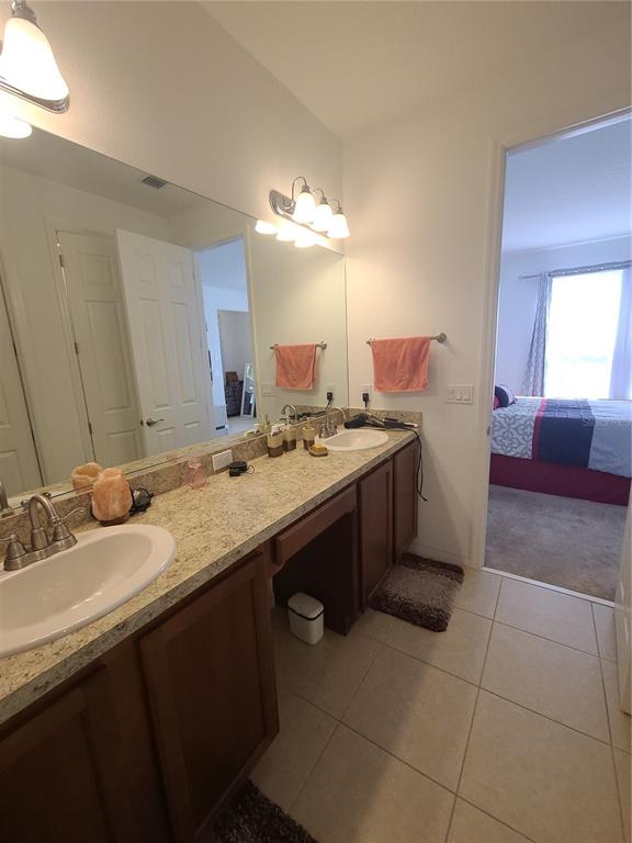 5380 Northwest 43rd Ln Road Ocala, FL 34482 - Photo 49 of 54 a bathroom with a sink a vanity and a mirror