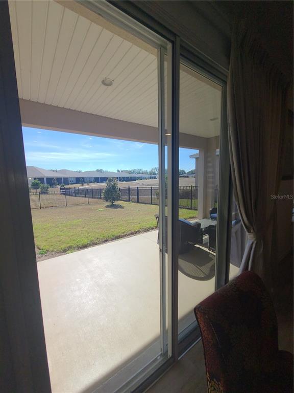 5380 Northwest 43rd Ln Road Ocala, FL 34482 - Photo 52 of 54 a view of a swimming pool and floor to ceiling window