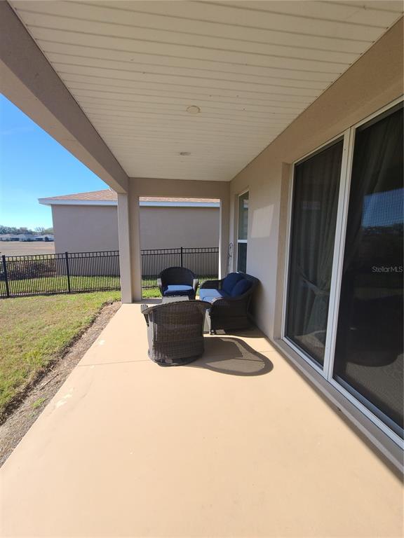 5380 Northwest 43rd Ln Road Ocala, FL 34482 - Photo 53 of 54 a large bed sitting in a spacious bedroom next to a window