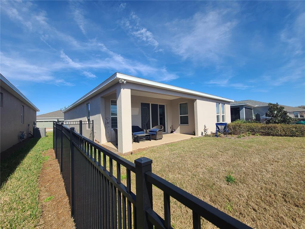 5380 Northwest 43rd Ln Road Ocala, FL 34482 - Photo 9 of 54 a view of a house with backyard and deck