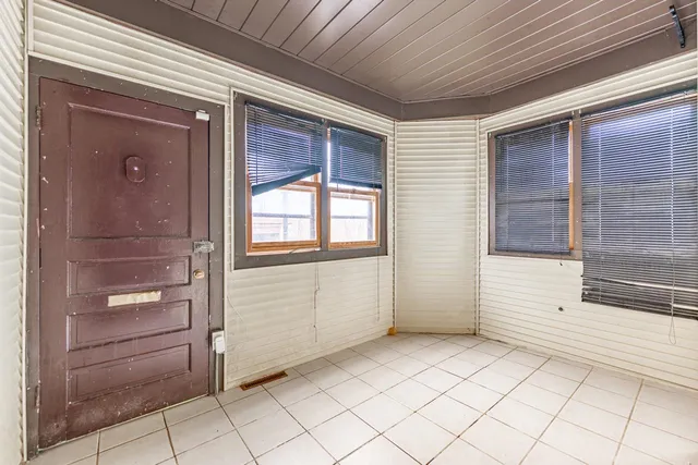 a view of an empty room and window