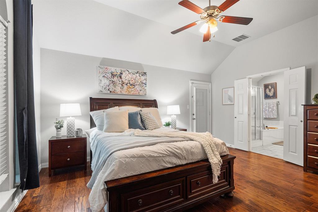 1501 Valley Creek Road Denton, TX 76205 - Photo 18 of 40 a bedroom with a bed and wooden floor