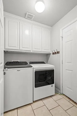 a utility room with washer and dryer