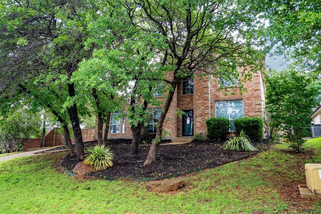 1501 Valley Creek Road Denton, TX 76205 - Photo 3 of 40 a front view of a house with a yard