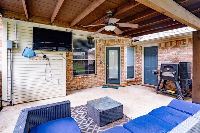 a view of a livingroom with furniture and a flat screen tv