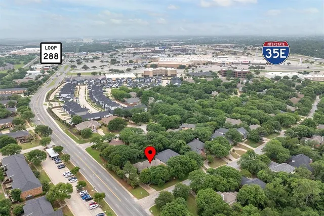 an aerial view of beach and sign board