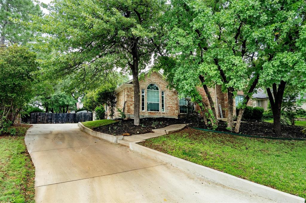 1501 Valley Creek Road Denton, TX 76205 - Photo 4 of 40 a front view of a house with a yard