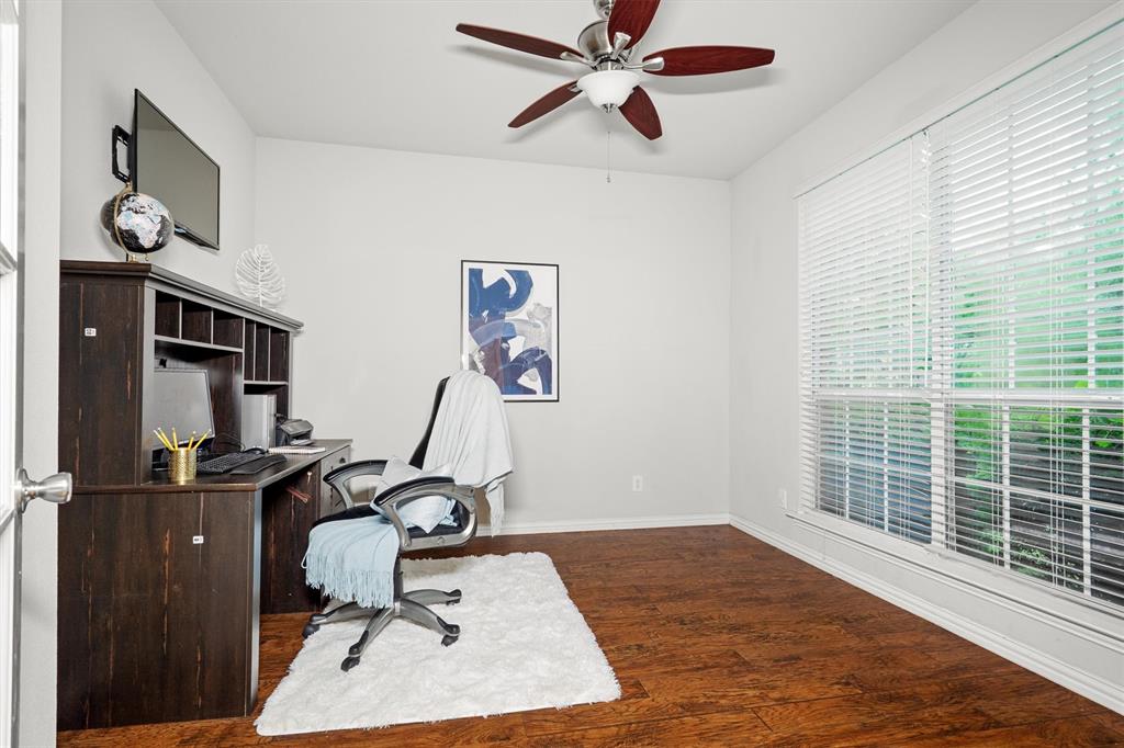 1501 Valley Creek Road Denton, TX 76205 - Photo 7 of 40 a view of a workspace with furniture and a window