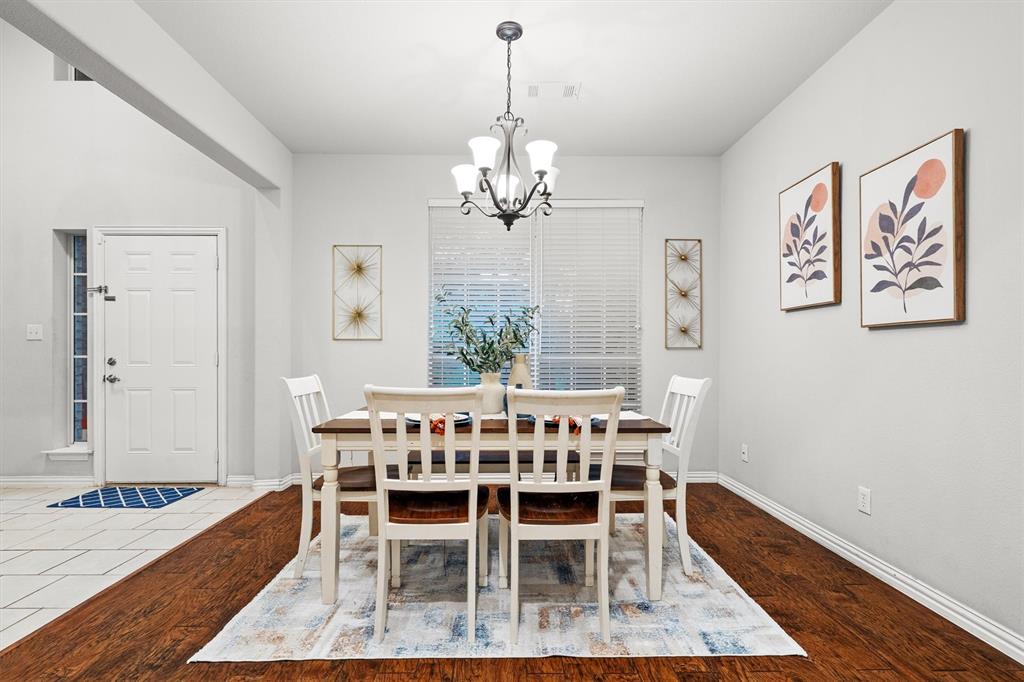 1501 Valley Creek Road Denton, TX 76205 - Photo 9 of 40 a view of a dining room with furniture window and wooden floor