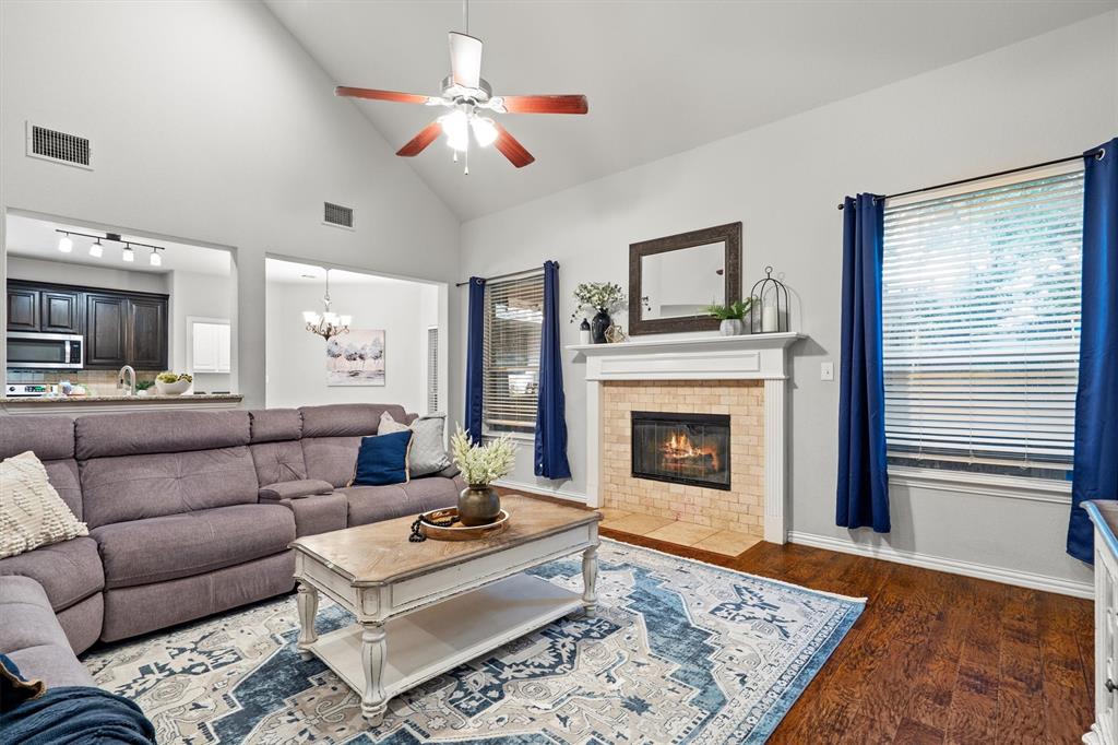 1501 Valley Creek Road Denton, TX 76205 - Photo 10 of 40 a living room with furniture and a fireplace