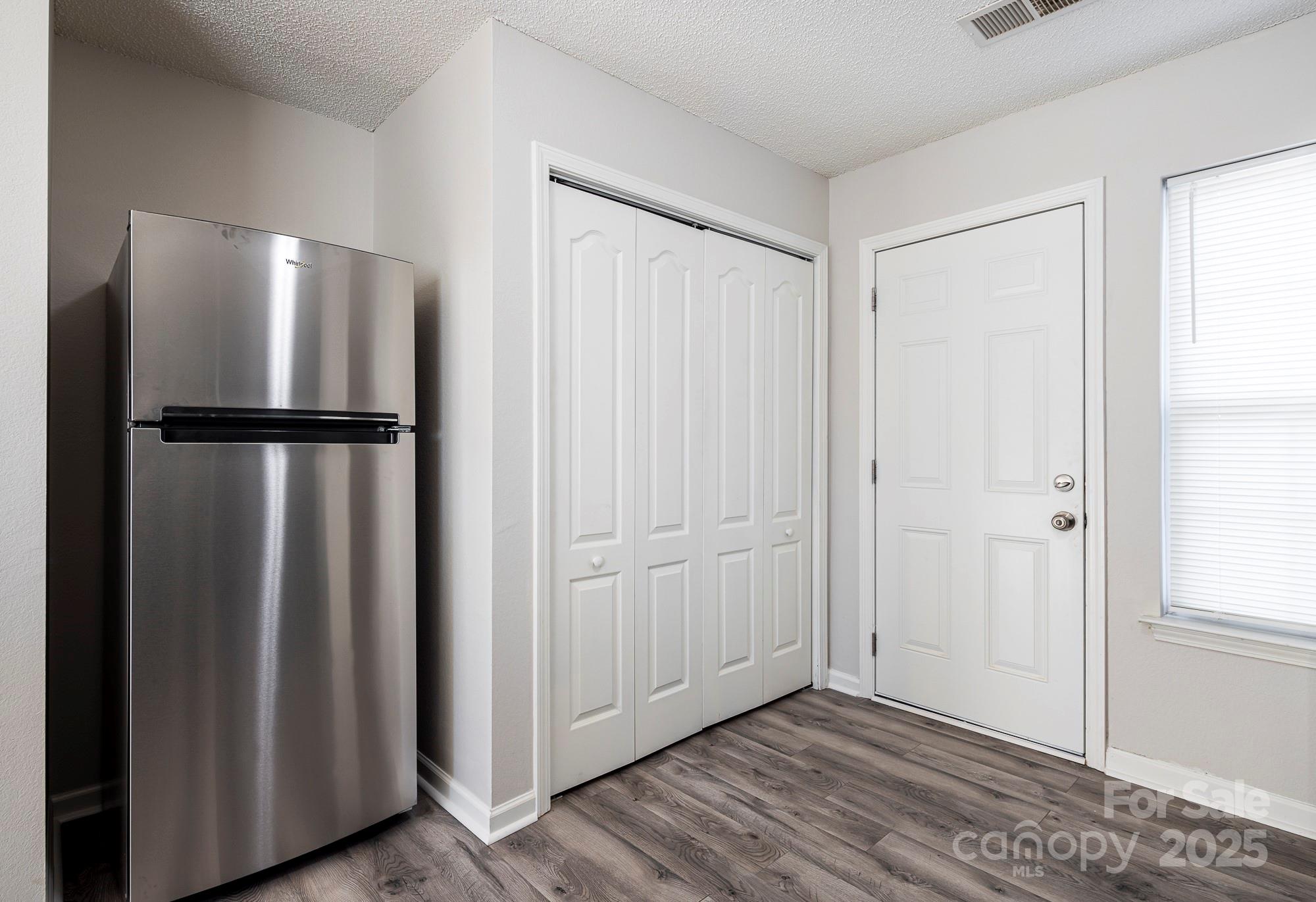 162 None Road Columbia, SC 29223 - Photo 12 of 24 a view of kitchen with refrigerator and wooden floor