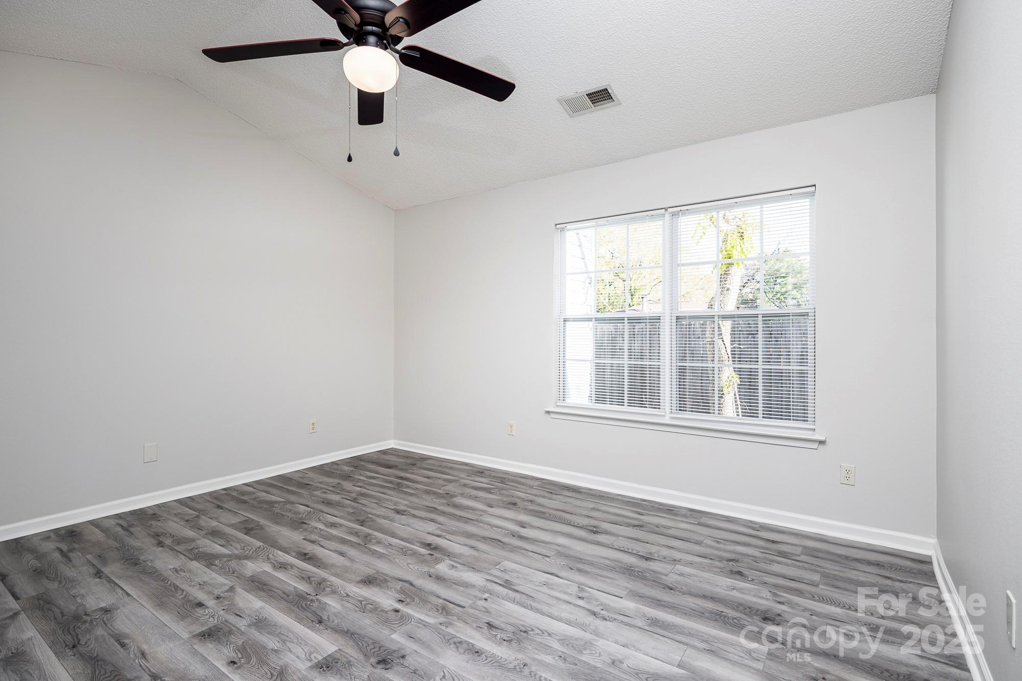 162 None Road Columbia, SC 29223 - Photo 13 of 24 wooden floor in an empty room with a window