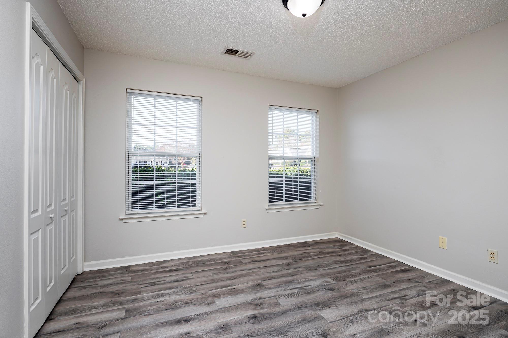 162 None Road Columbia, SC 29223 - Photo 17 of 24 an empty room with wooden floor and windows