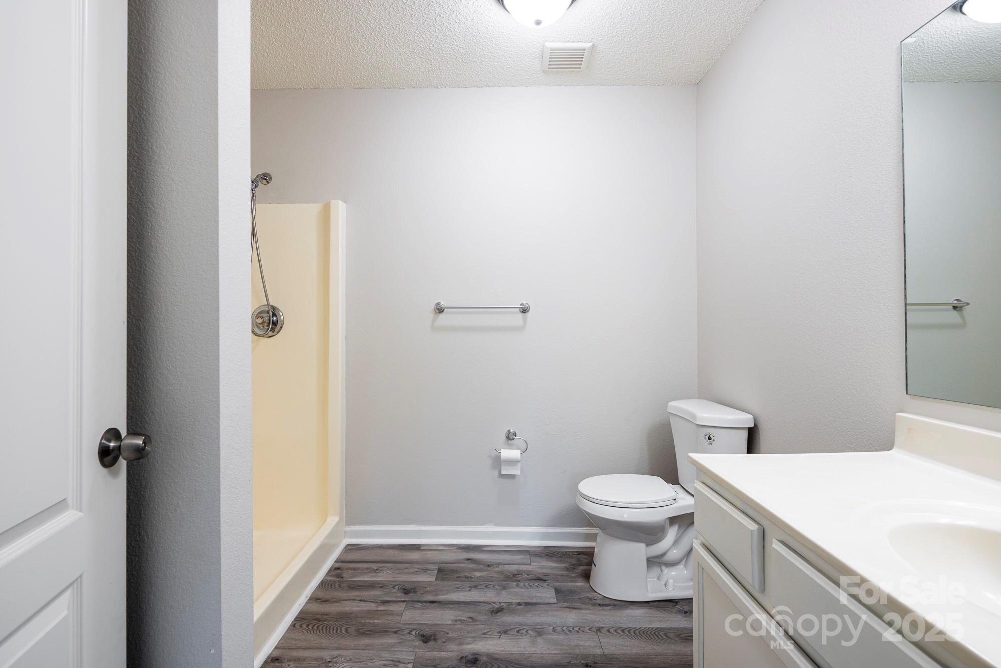 162 None Road Columbia, SC 29223 - Photo 20 of 24 a white toilet sitting next to a bathroom sink