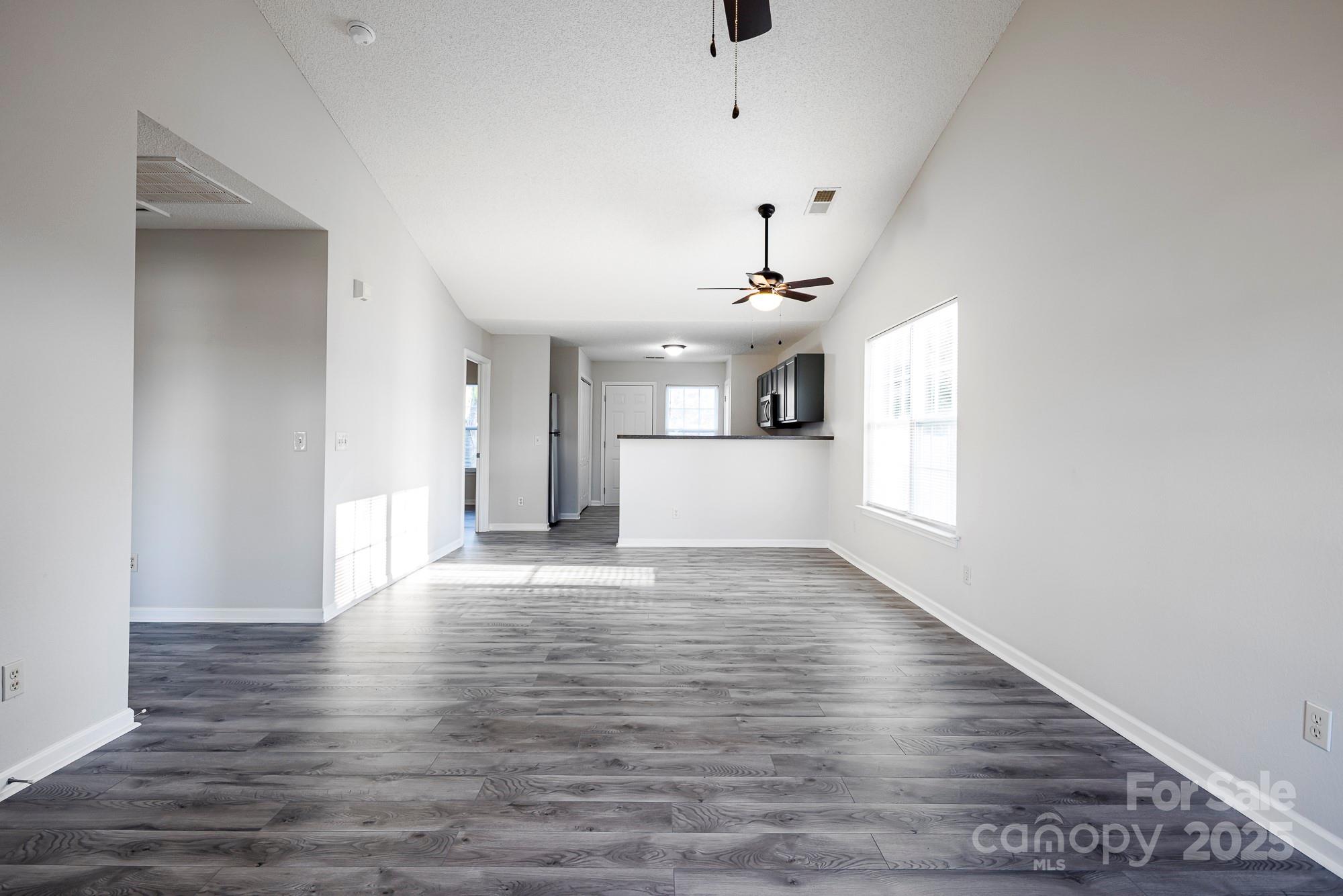 162 None Road Columbia, SC 29223 - Photo 2 of 24 a view of an empty room with wooden floor and a window