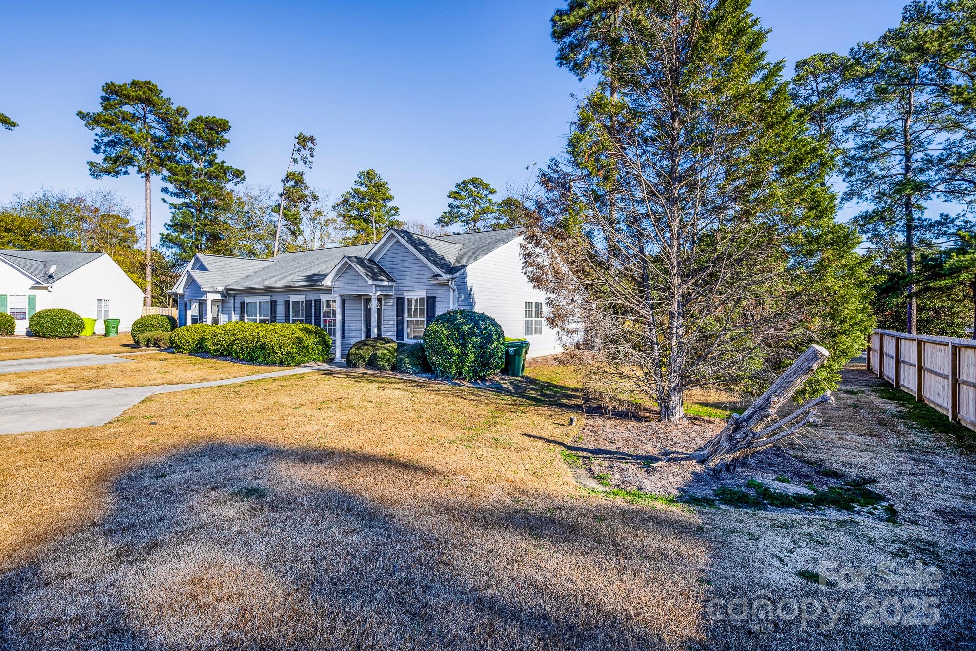 162 None Road Columbia, SC 29223 - Photo 23 of 24 a view of an house with backyard and a tree