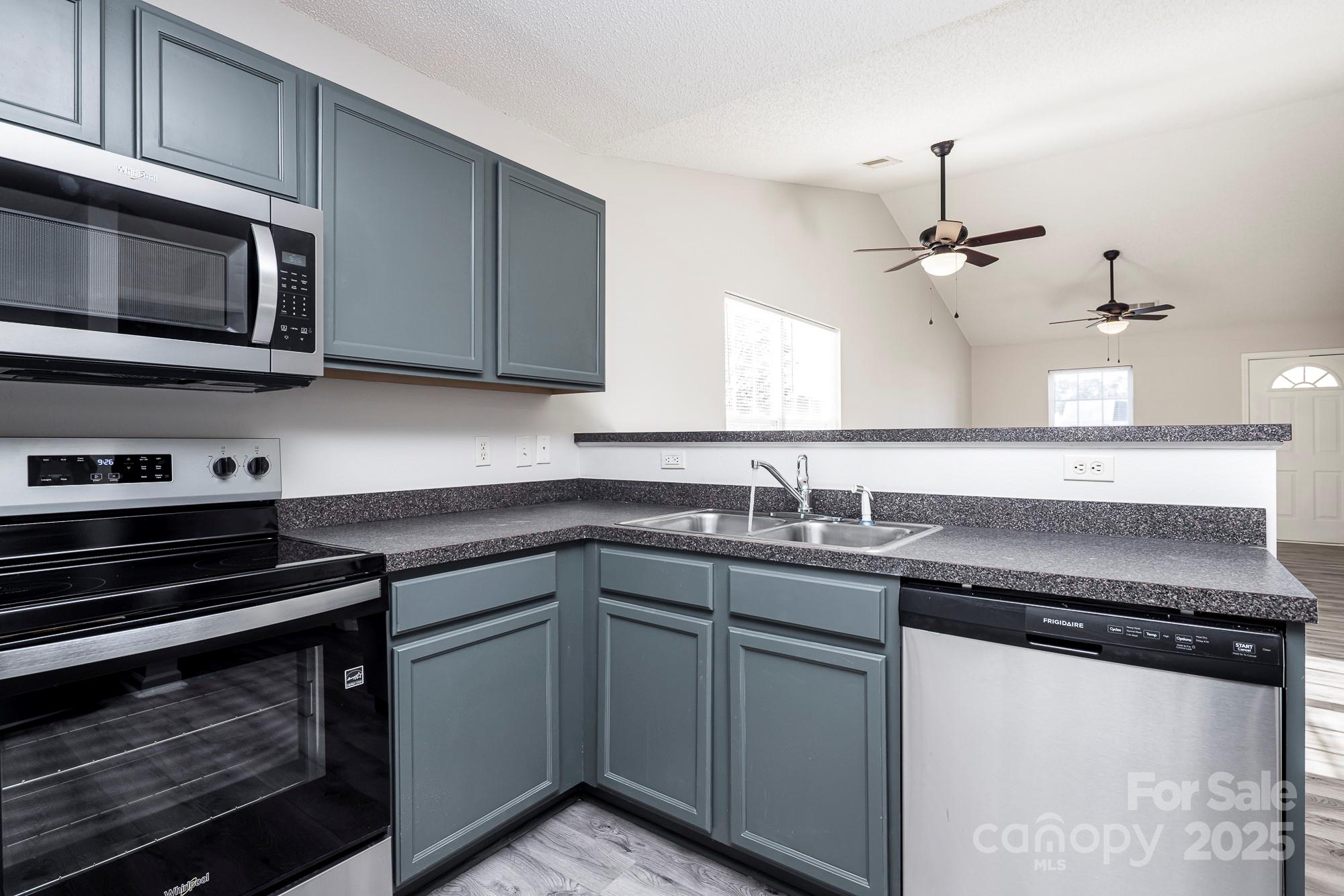 162 None Road Columbia, SC 29223 - Photo 6 of 24 a kitchen with stainless steel appliances a sink stove and microwave