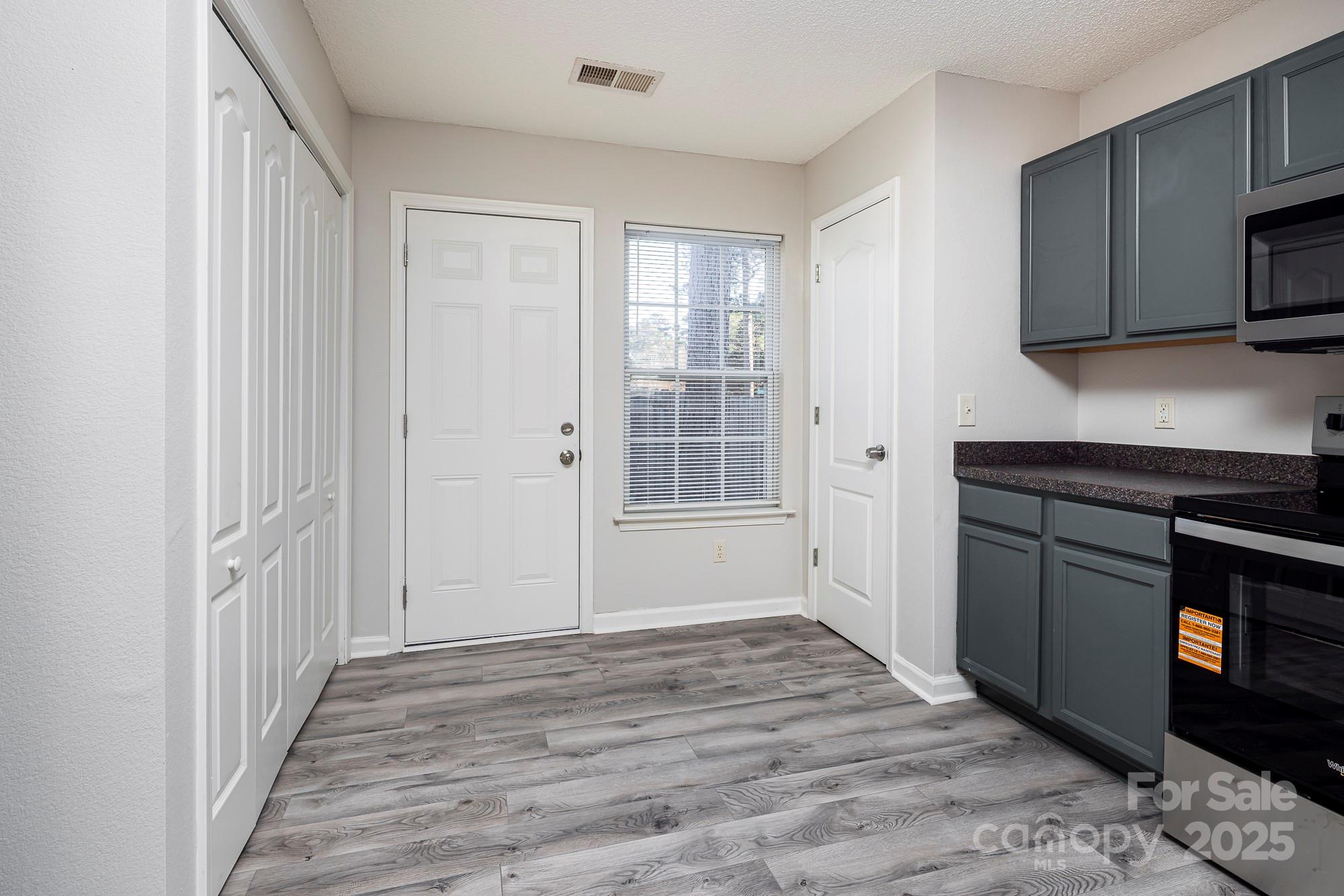 162 None Road Columbia, SC 29223 - Photo 8 of 24 a view of a kitchen with a sink and dishwasher wooden floor