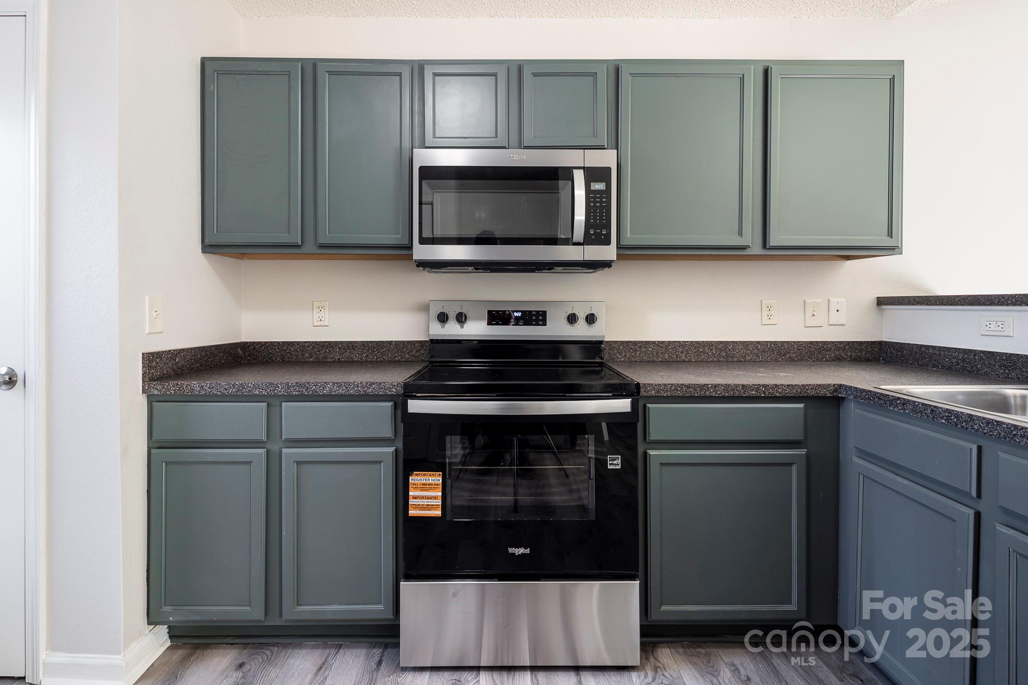 162 None Road Columbia, SC 29223 - Photo 9 of 24 a kitchen with stainless steel appliances granite countertop a stove and a microwave