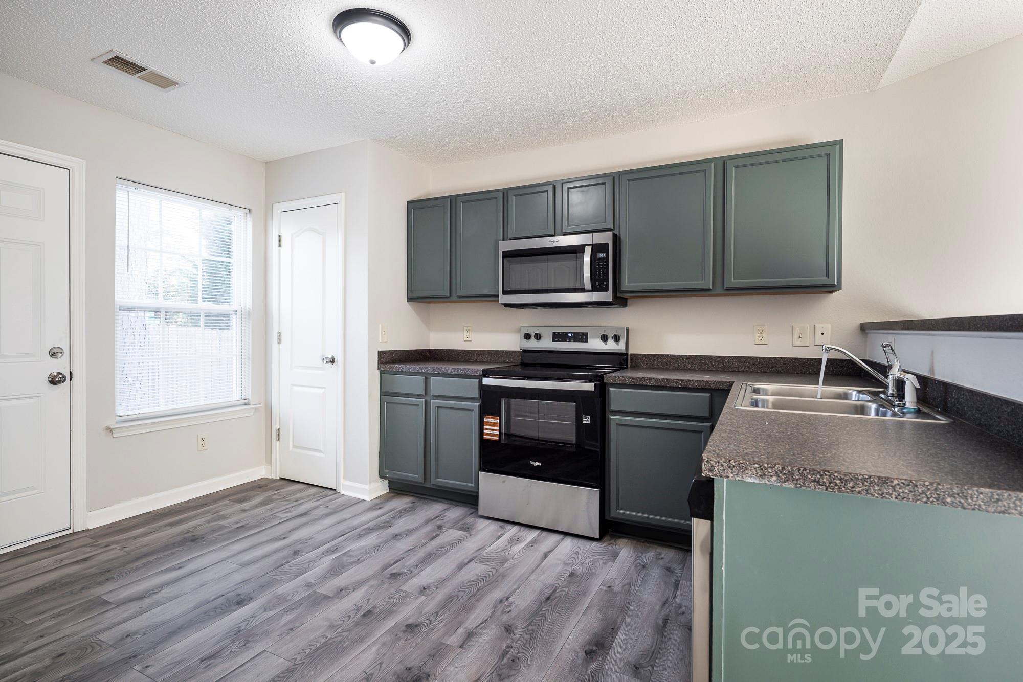 162 None Road Columbia, SC 29223 - Photo 10 of 24 a kitchen with a sink appliances and cabinets