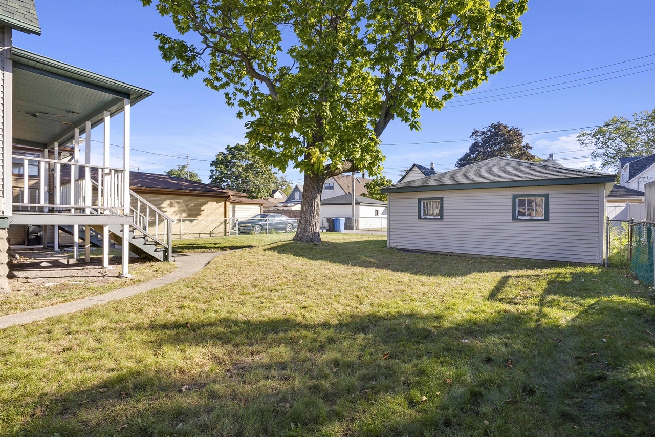 13331 South Commercial Avenue Chicago, IL 60633 - Photo 14 of 14 a view of a house with a yard