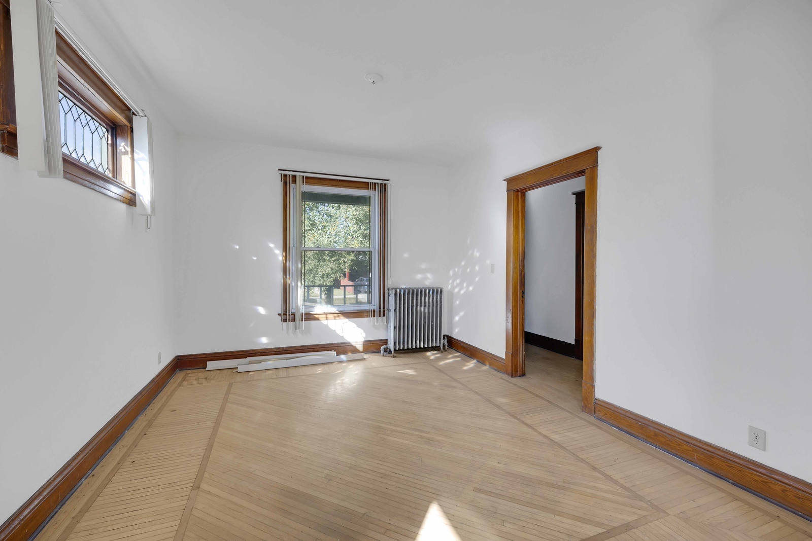 13331 South Commercial Avenue Chicago, IL 60633 - Photo 3 of 14 a view of an empty room with wooden floor and a window