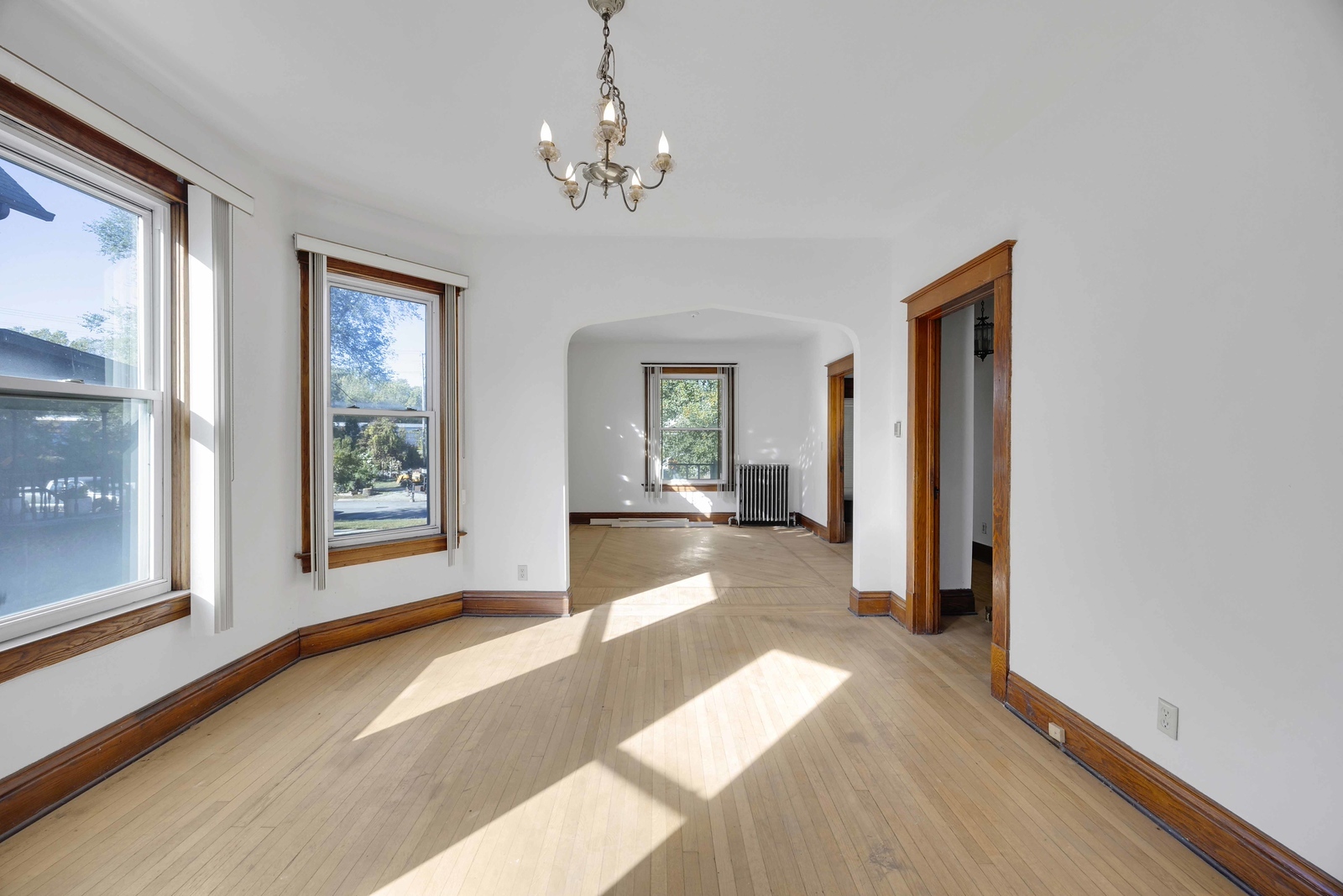 13331 South Commercial Avenue Chicago, IL 60633 - Photo 5 of 14 a view of a hallway with wooden floor and chandelier