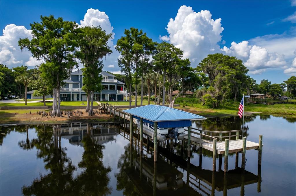 1360 South Waterview Drive Inverness, FL 34450 - Photo 11 of 100 a view of a lake with a table and a chairs