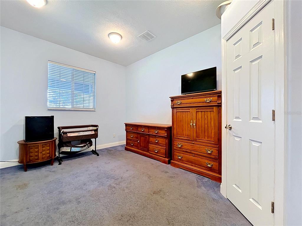 1360 South Waterview Drive Inverness, FL 34450 - Photo 29 of 100 a living room with furniture and a flat screen tv